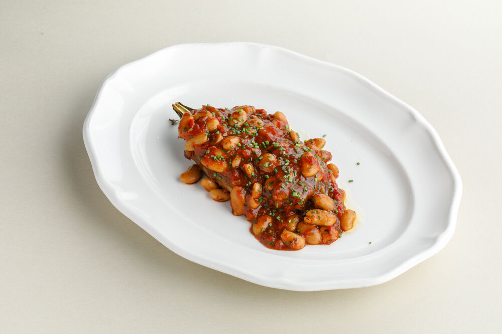 Eggplant with white baens and tomato sauce