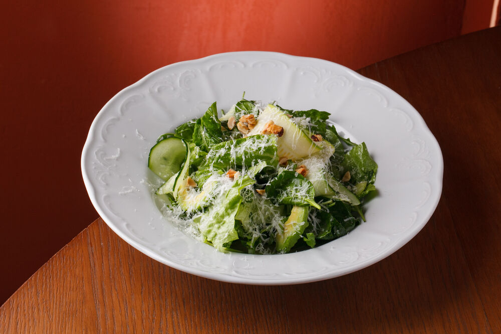 Green salad with parmesan and hazelnuts