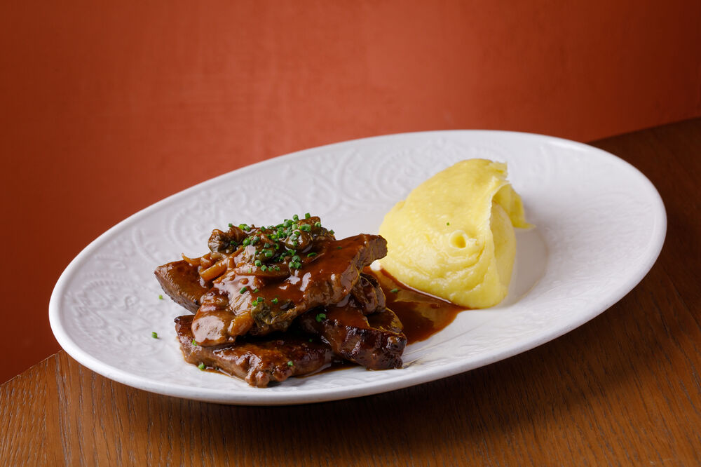 Veal liver with mashed potatoes in demi-glace sauce