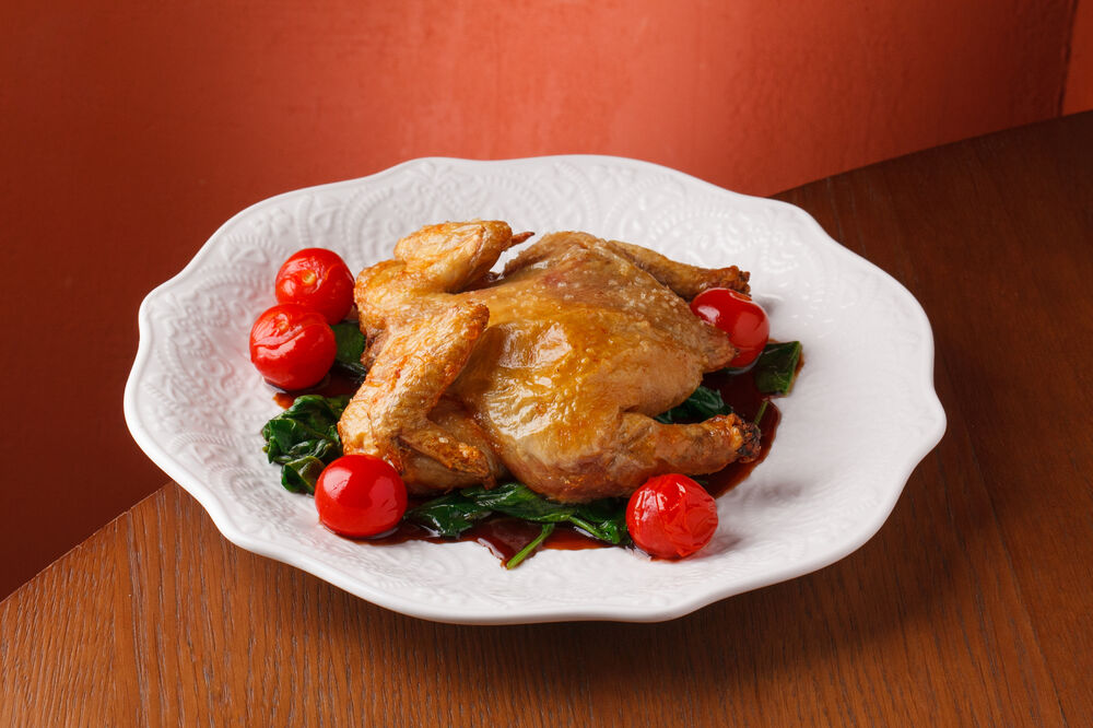 Baked chicken with spinach and cherry tomatoes
