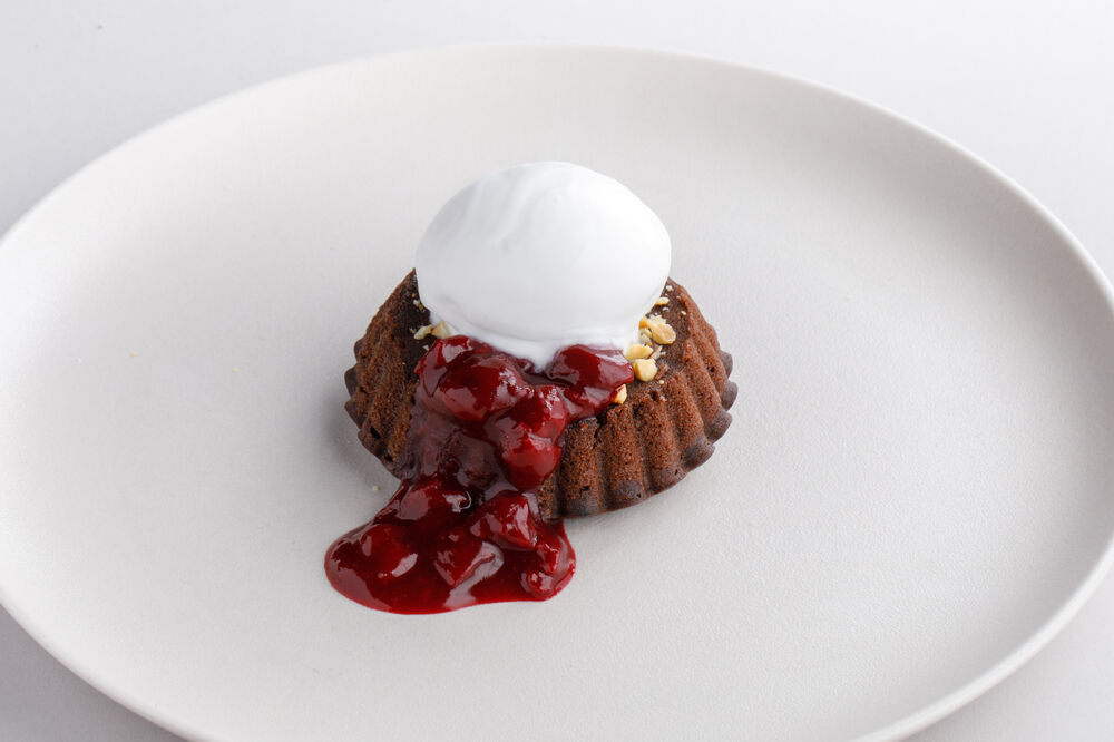 Brownie with cherry sage sause and coconut sorbet