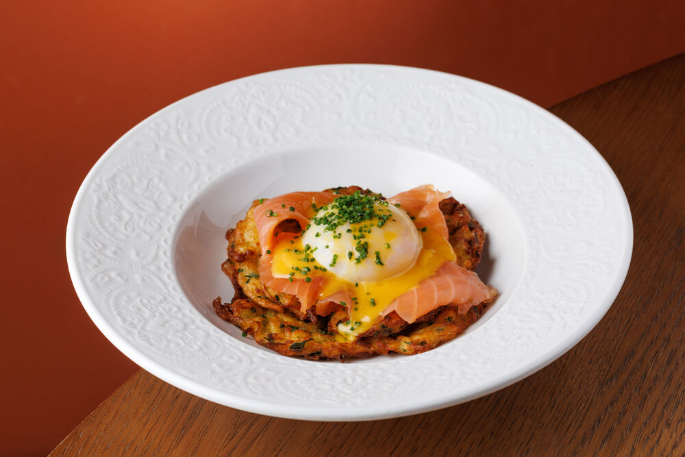 Potato pancakes with poached egg and salmon