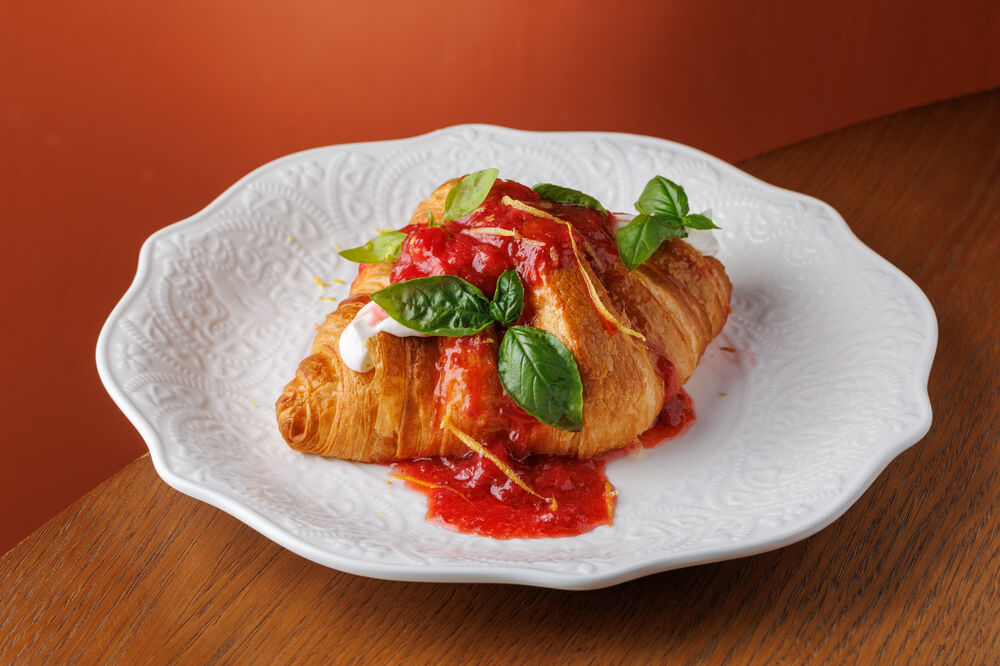 Croissant with white chocolate ganache and strawberry jam
