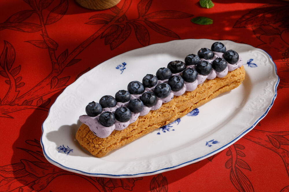 Eclair with blueberry cream