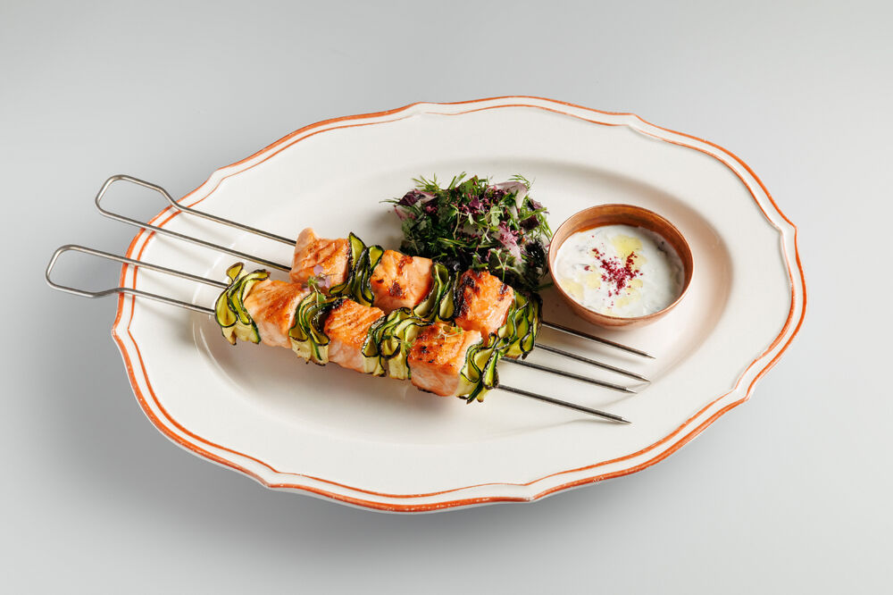 Salmon skewers with zucchini and zajiki sauce