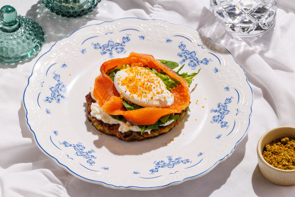 Zucchini pancake with stracciatella, salmon and poached egg