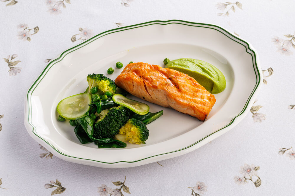 Murmansk salmon with green pea cream and vegetables