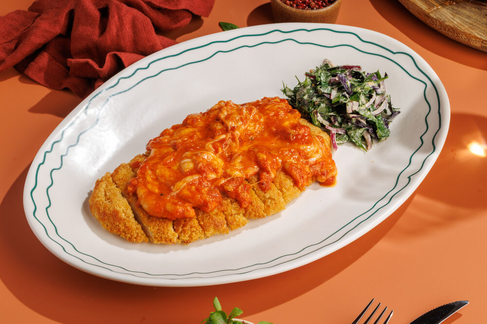 Chicken schnitzel with tomatoes and mozzarella