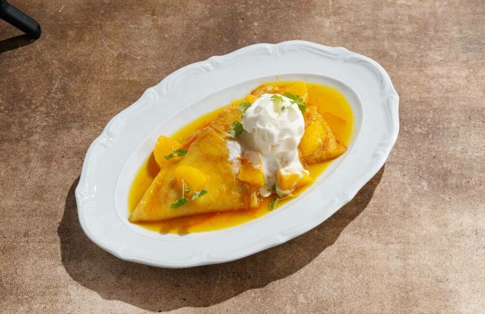 Crêpe Suzette pancakes with ice cream