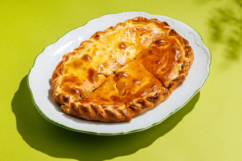 Pie with salmon, zander, and boiled egg