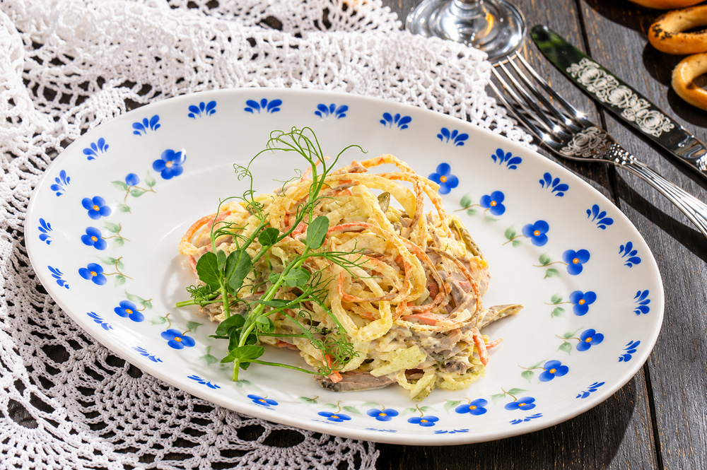 Salad with tongue and pickled cucumbers