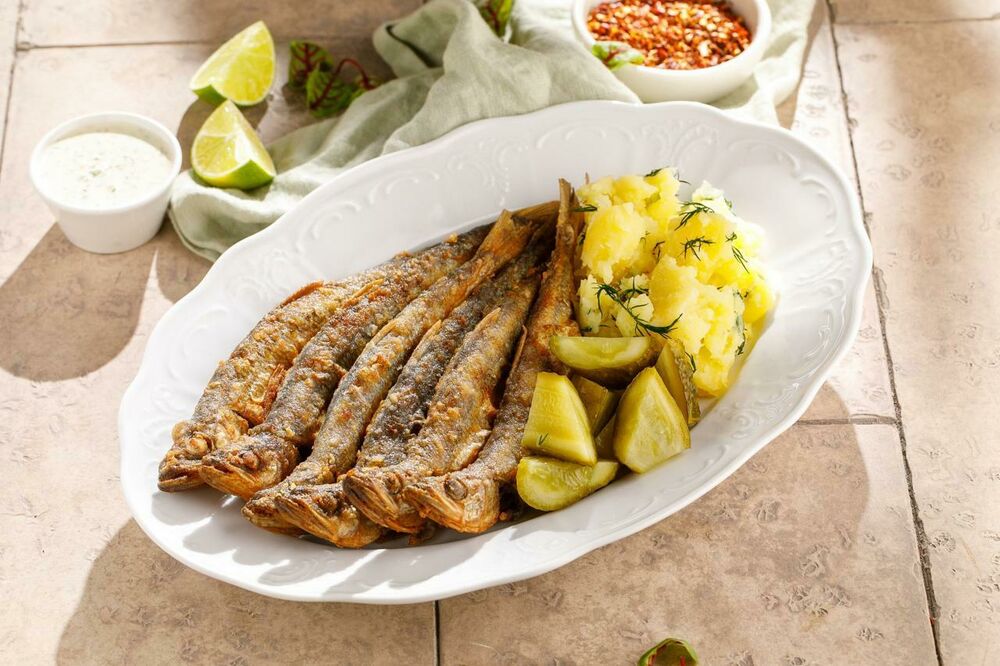 Fried smelt with potatoes and lightly salted cucumber