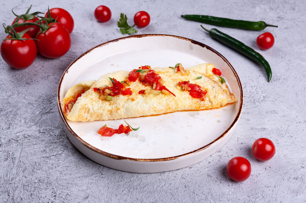 Omelet with vegetable salsa and cheese