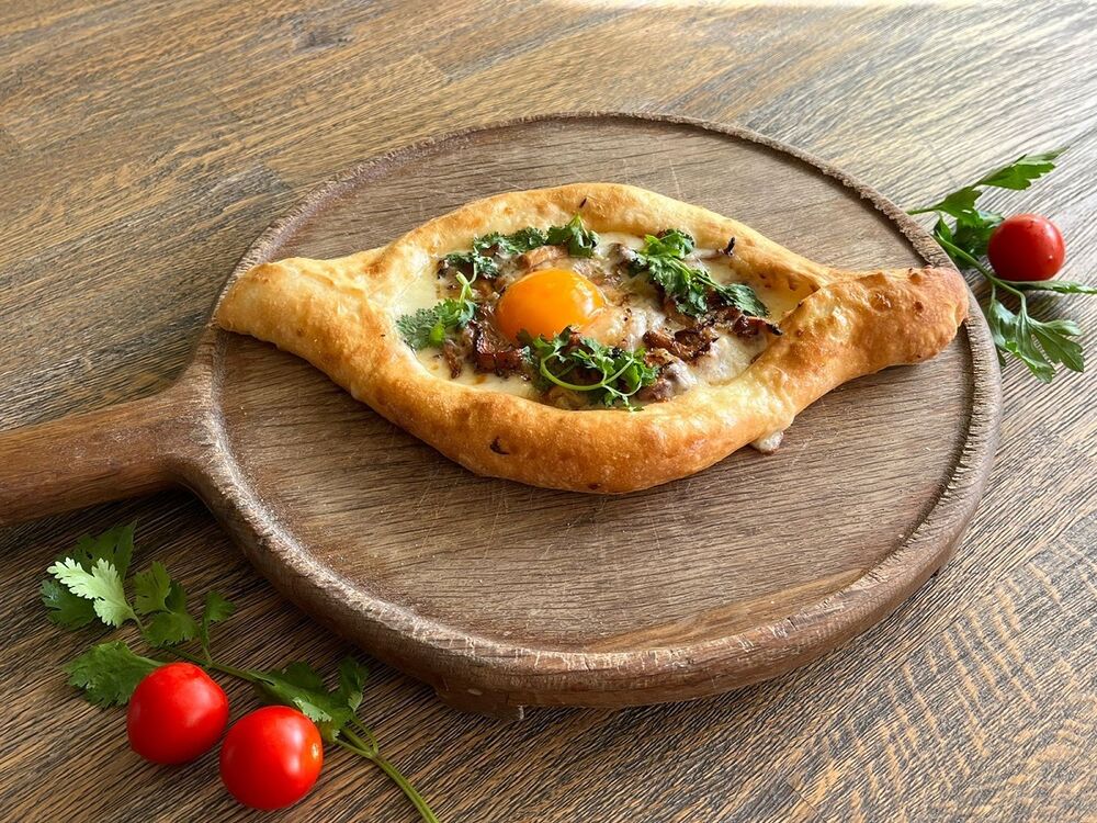 Khachapuri with smoked cheese and chanterelles