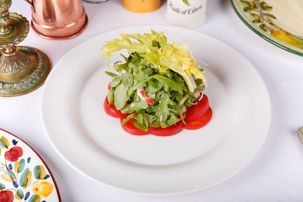 Salad with crab meat, cucumber, celery and arugula