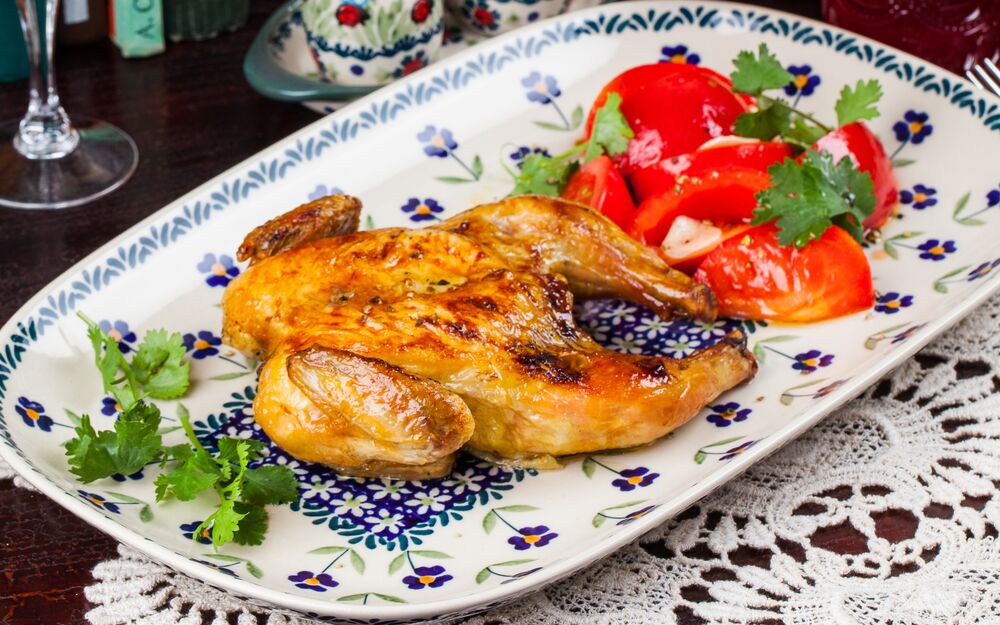 Farm chicken from the oven with Crimean tomato salad