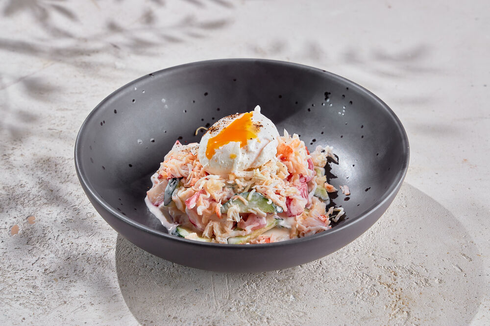 Salad with crab and poached egg