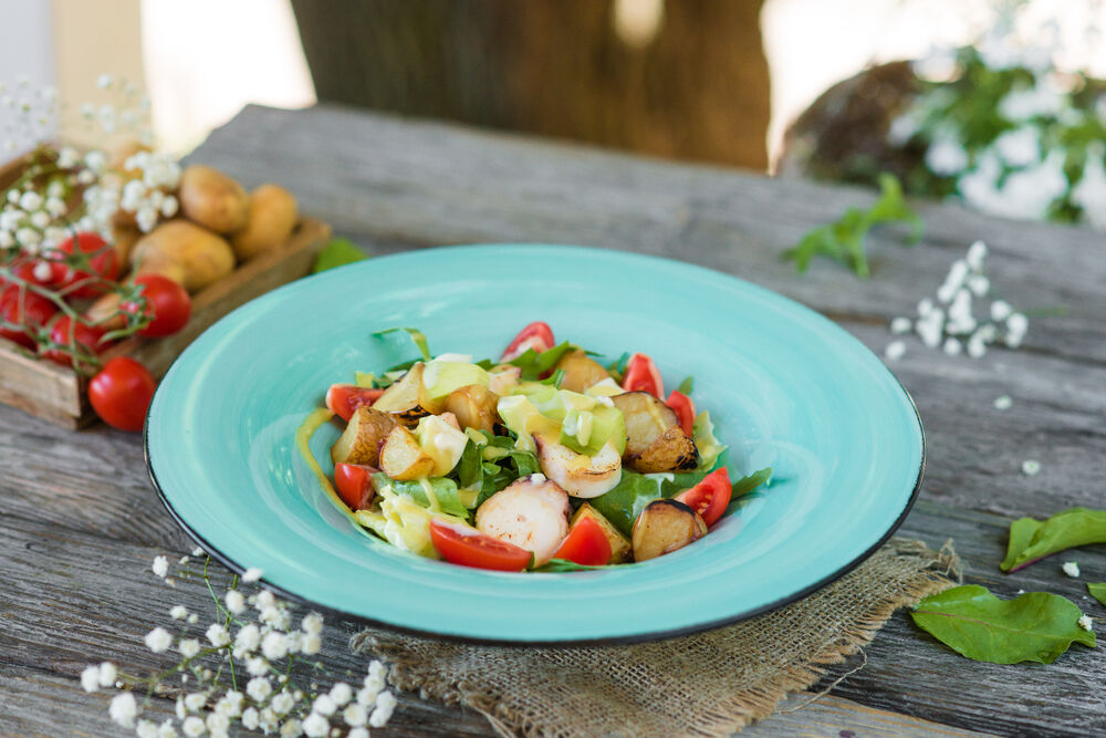 Salad with octopus, avocado and sweet tomatoes