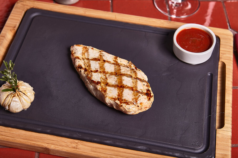 Grilled chicken breast with tomato sauce