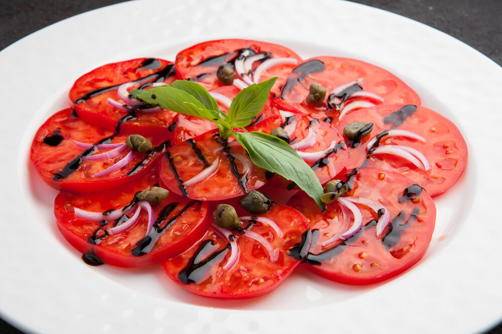 Tomatoes carpaccio with Yalta onion on promotion